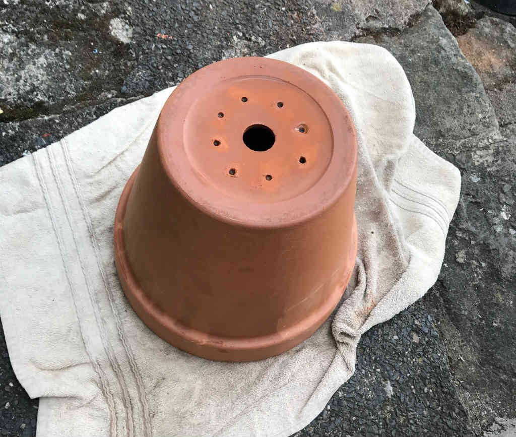 Drilled terracotta pot